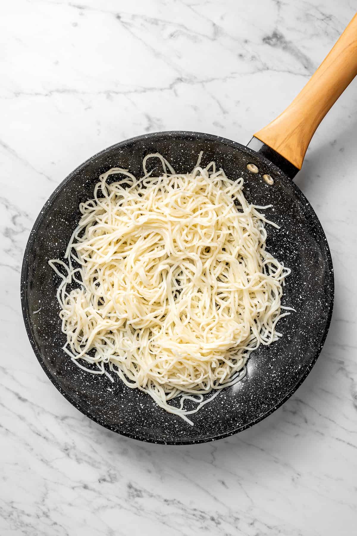 Overhead view of hearts of palm pasta in skillet