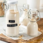 3 glass bottles of oat milk coffee creamer