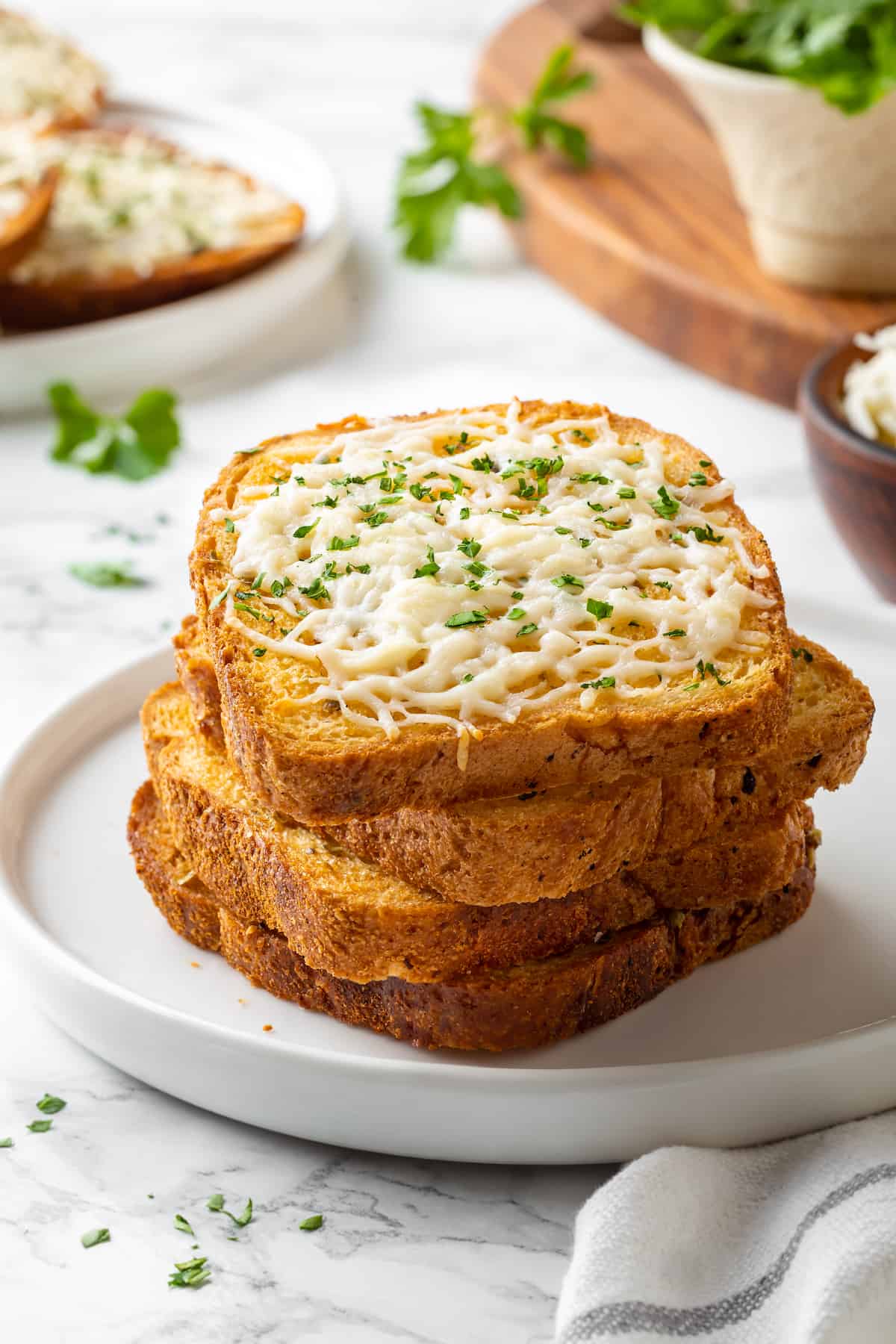 Stack of cheesy Texas toast on plate
