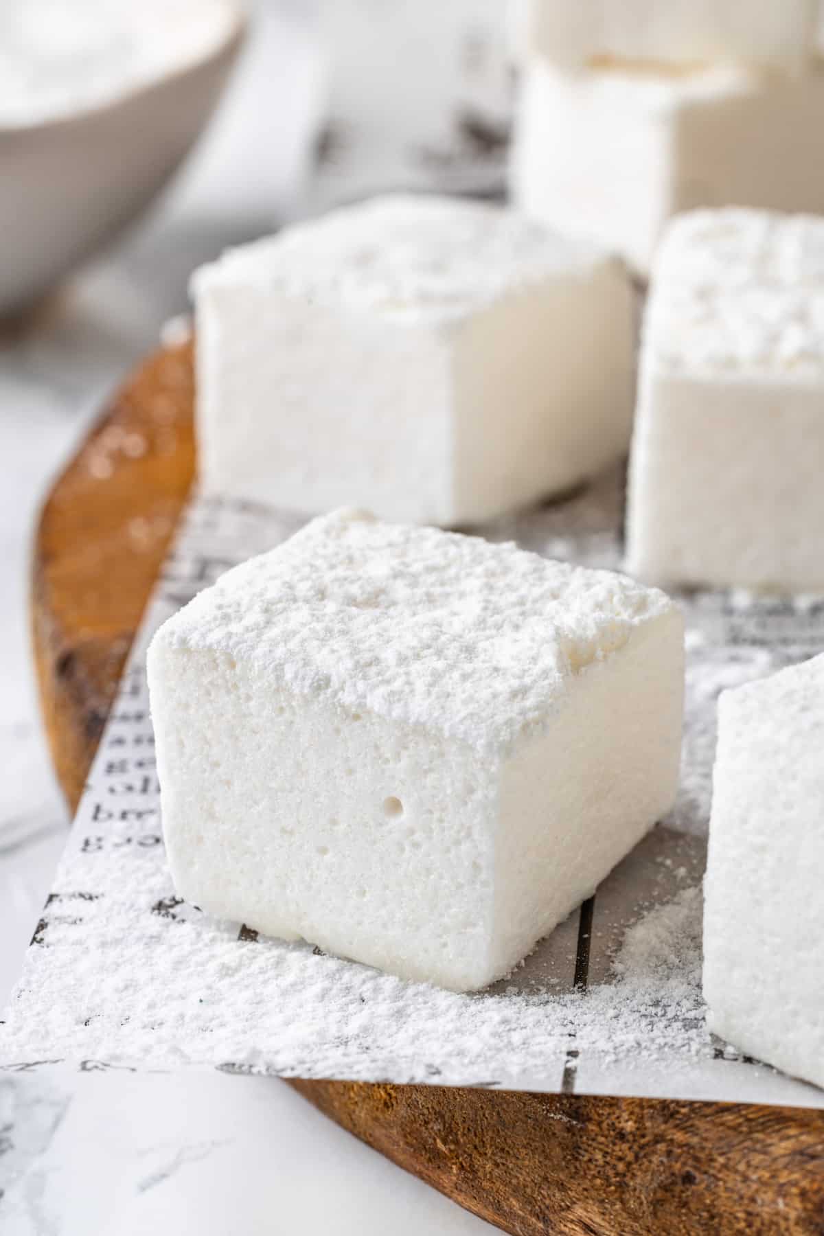 Closeup of vegan marshmallows dusted with powdered sugar and cornstarch