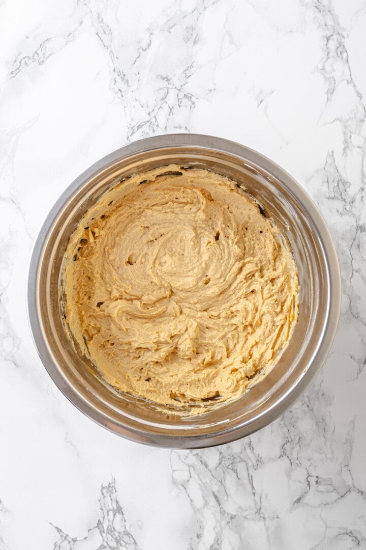 Overhead view of peanut butter cream cheese filling in mixing bowl