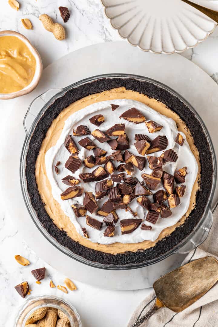 Overhead view of no-bake peanut butter pie in glass pie plate