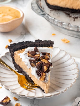 Slice of vegan no-bake peanut butter pie on plate with fork