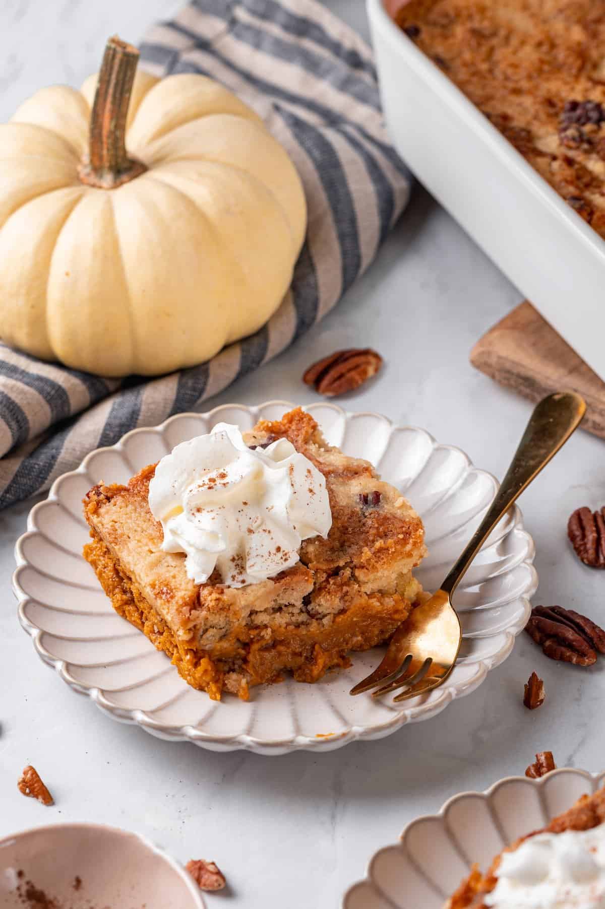 Plate with square of pumpkin dump cake and gold fork