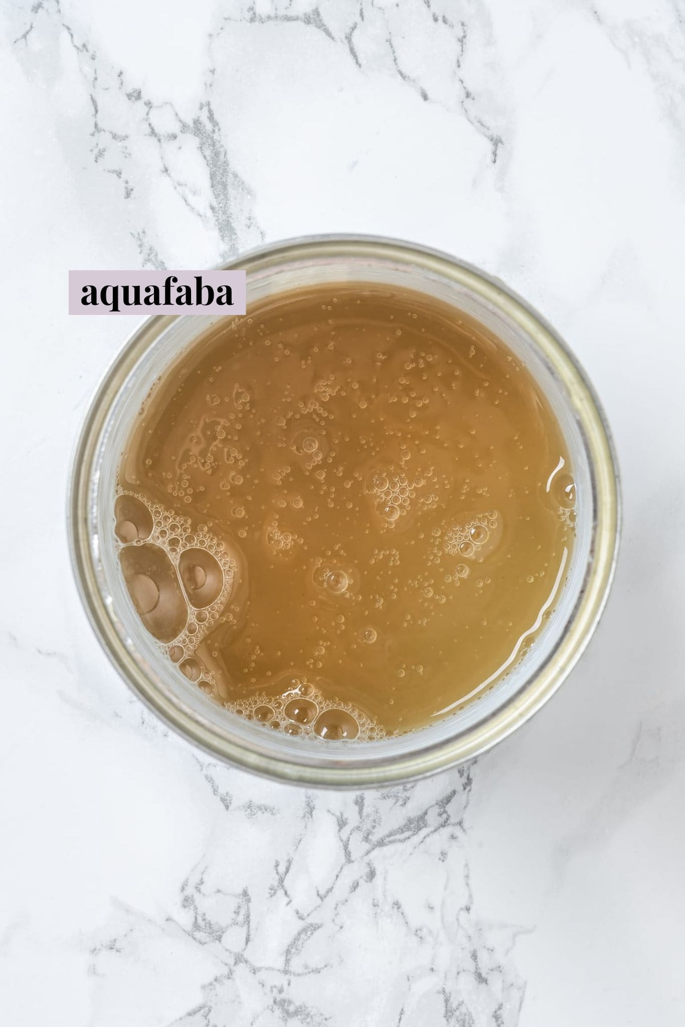 Overhead view of liquid from can of chickpeas