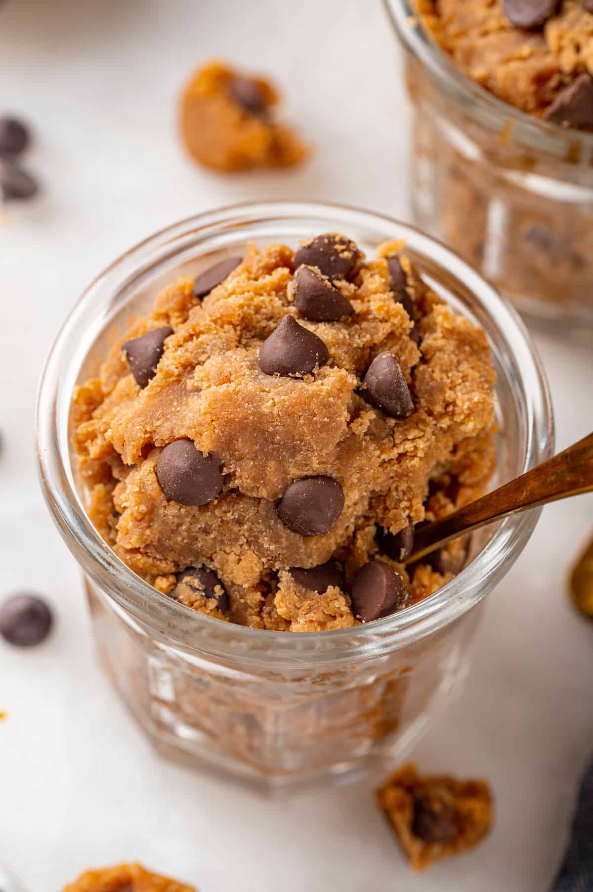 Jar of chocolate chip protein cookie dough with spoon