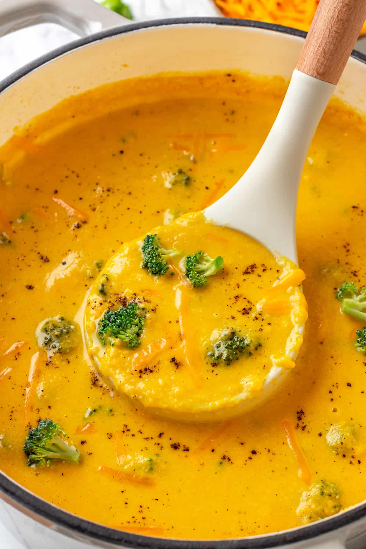 Ladle full of vegan broccoli cheddar soup