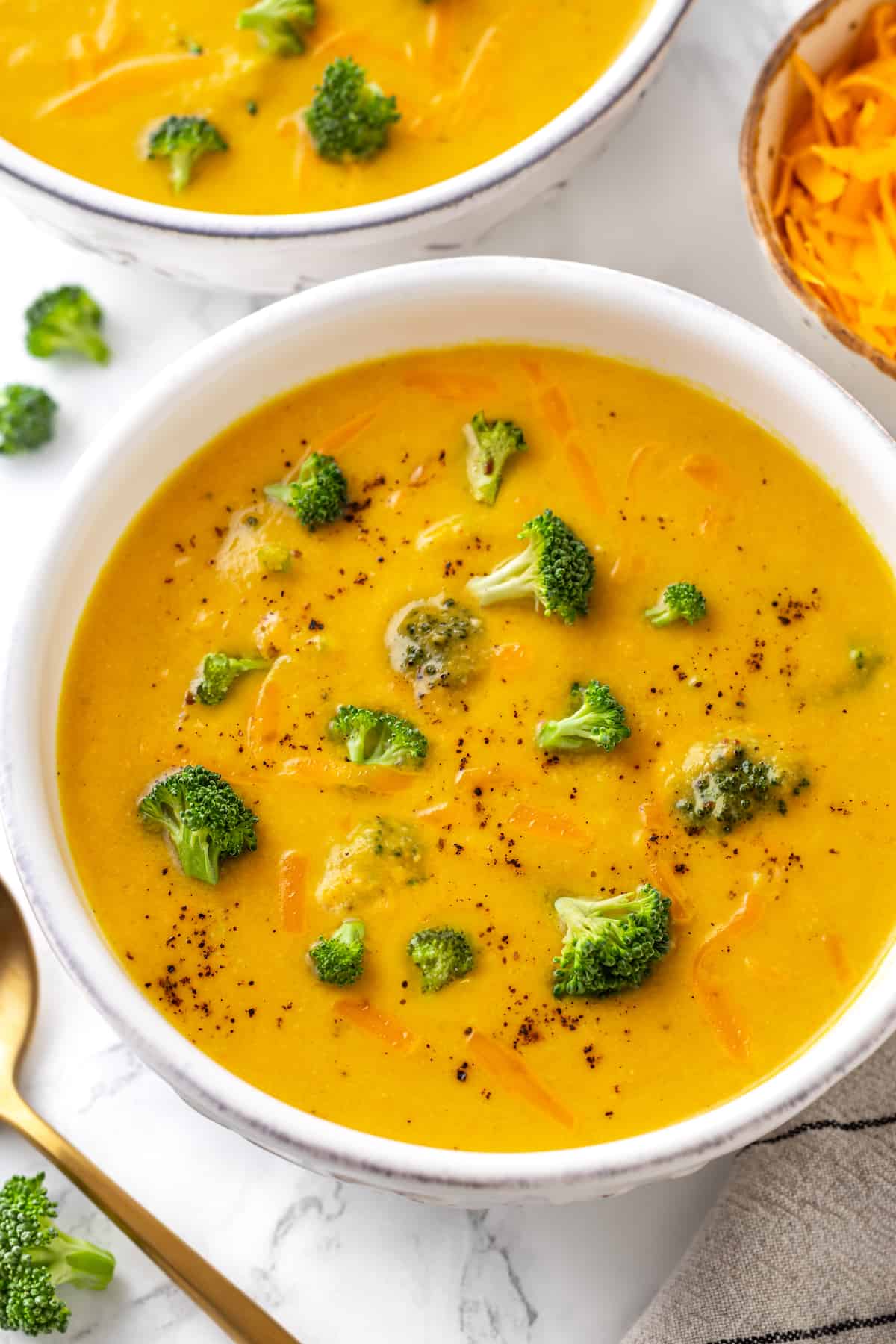 Overhead view of vegan broccoli cheddar soup in bowl