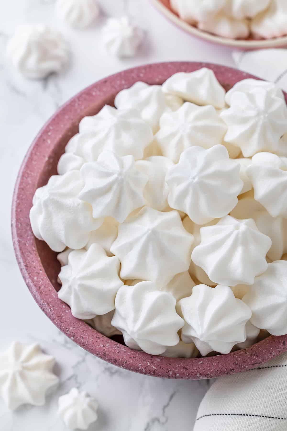 Vegan meringues in pink bowl