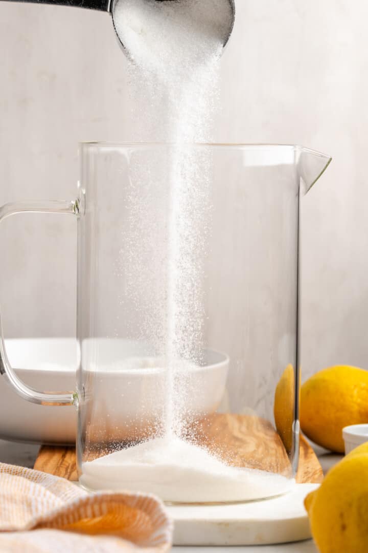 Pouring sugar into pitcher