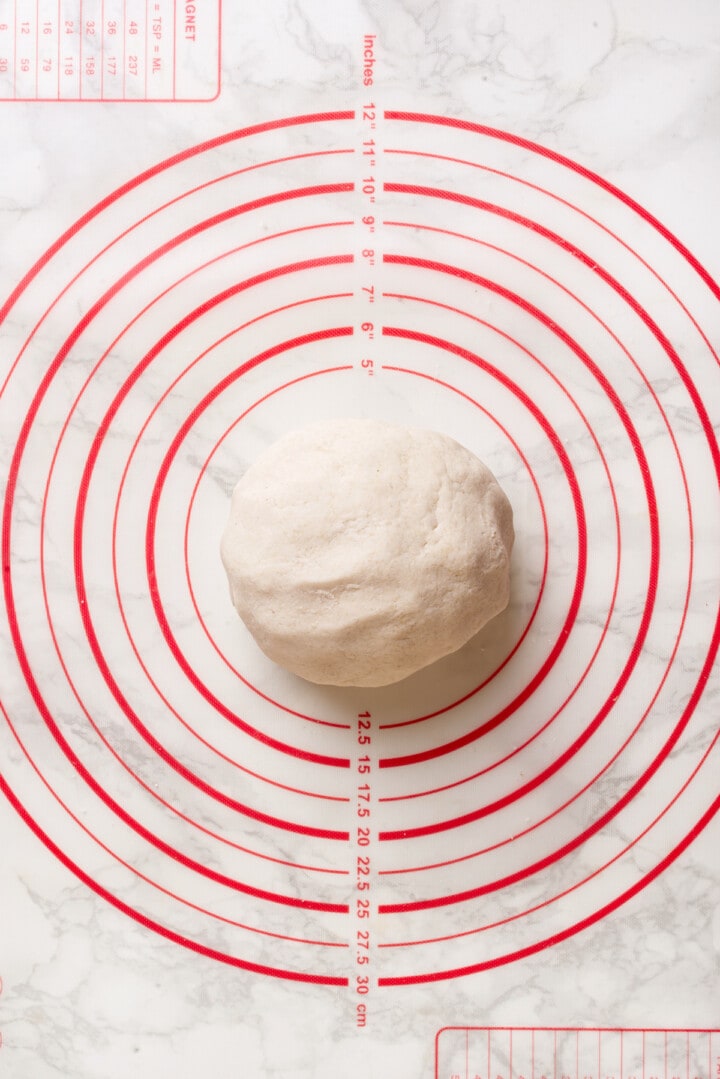 Overhead view of gnocchi dough on baking mat