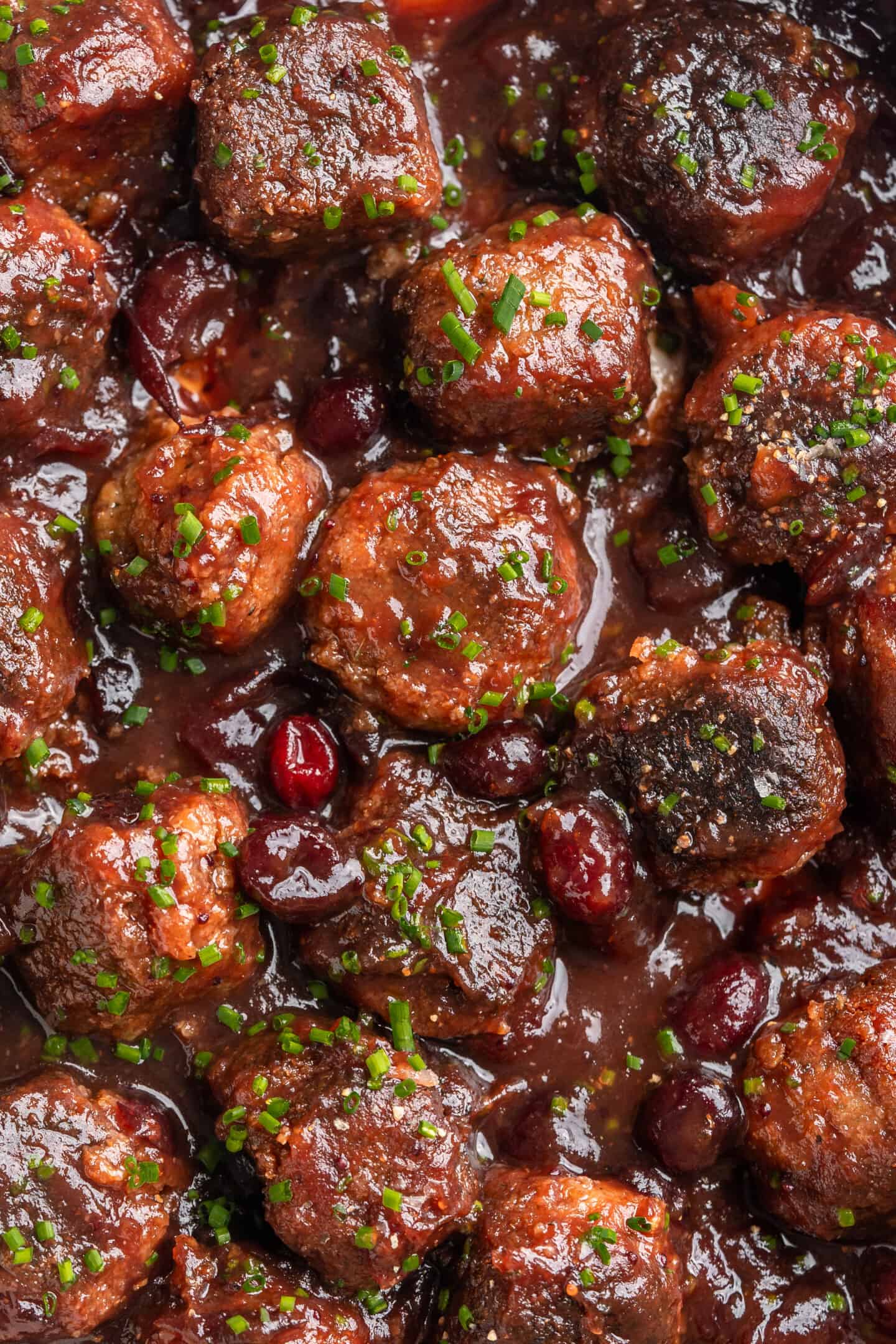 Overhead view of vegan cranberry meatballs in pan