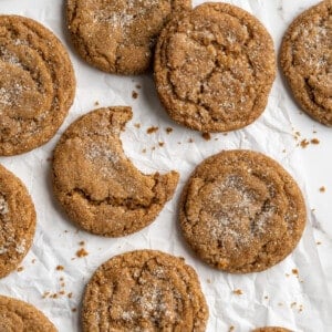 Overhead view of gingersnap molasses cookies on crumpled parchment