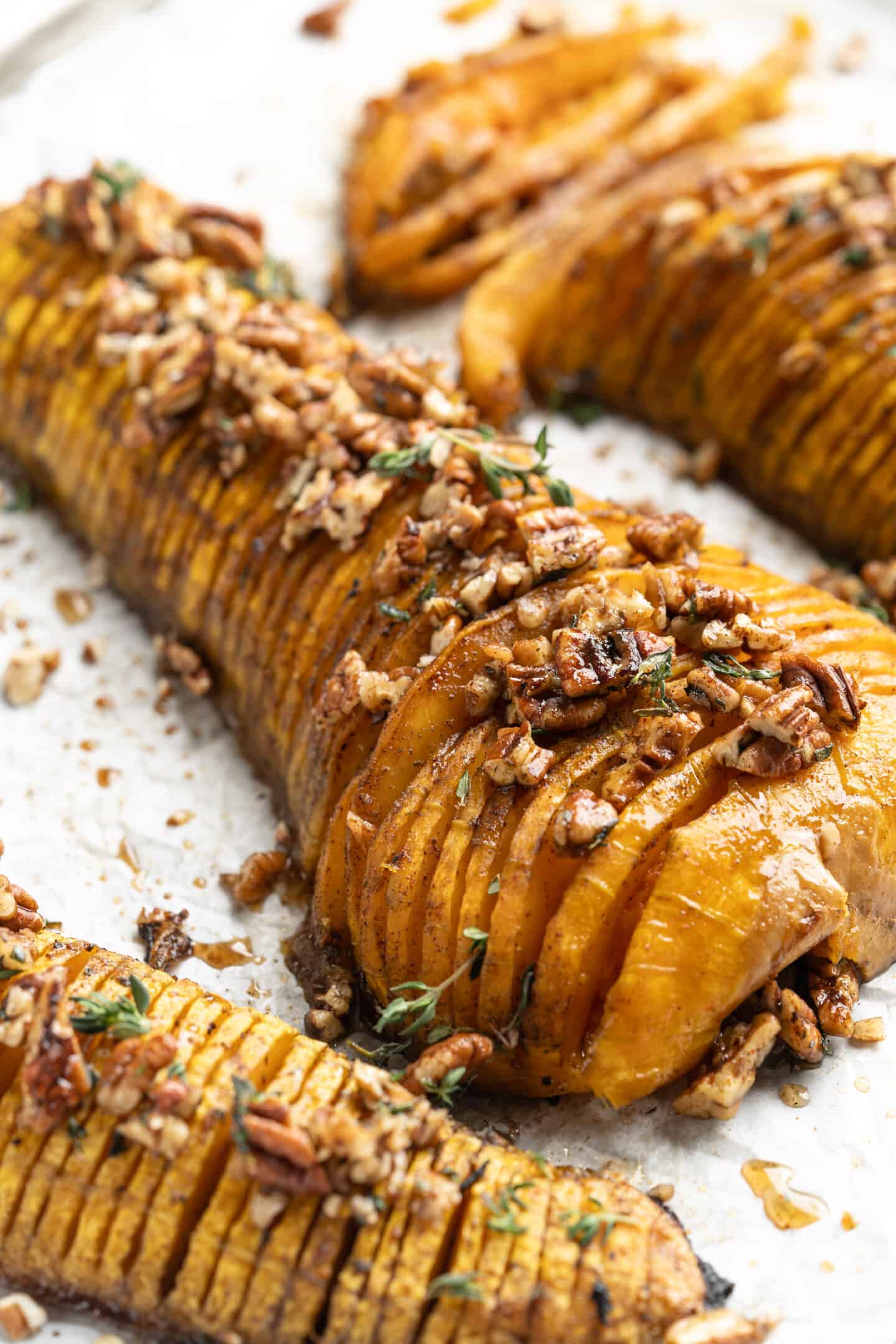 Hasselback butternut squash with maple glazed pecans and thyme