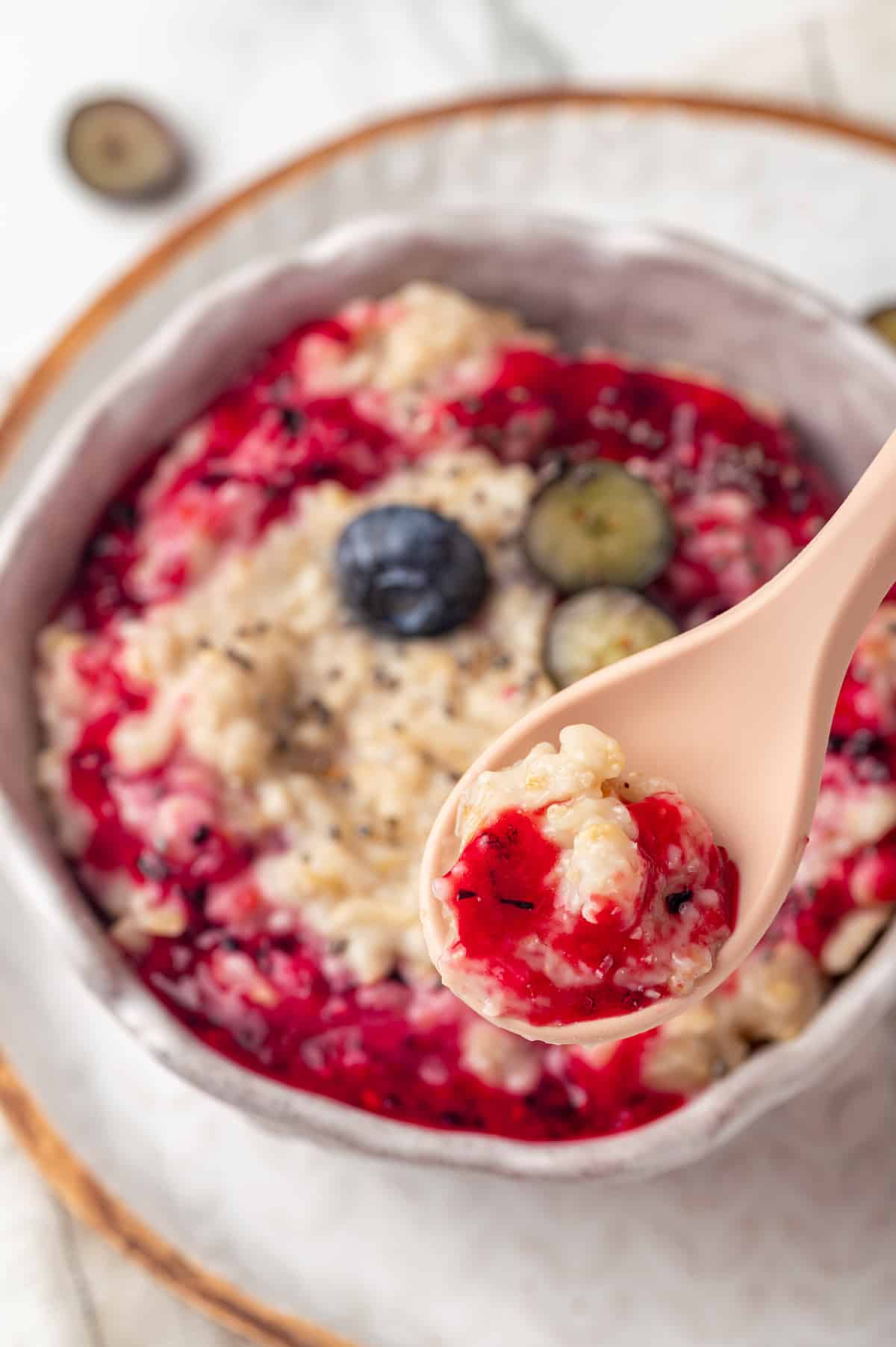 Spoonful of baby oatmeal with jam