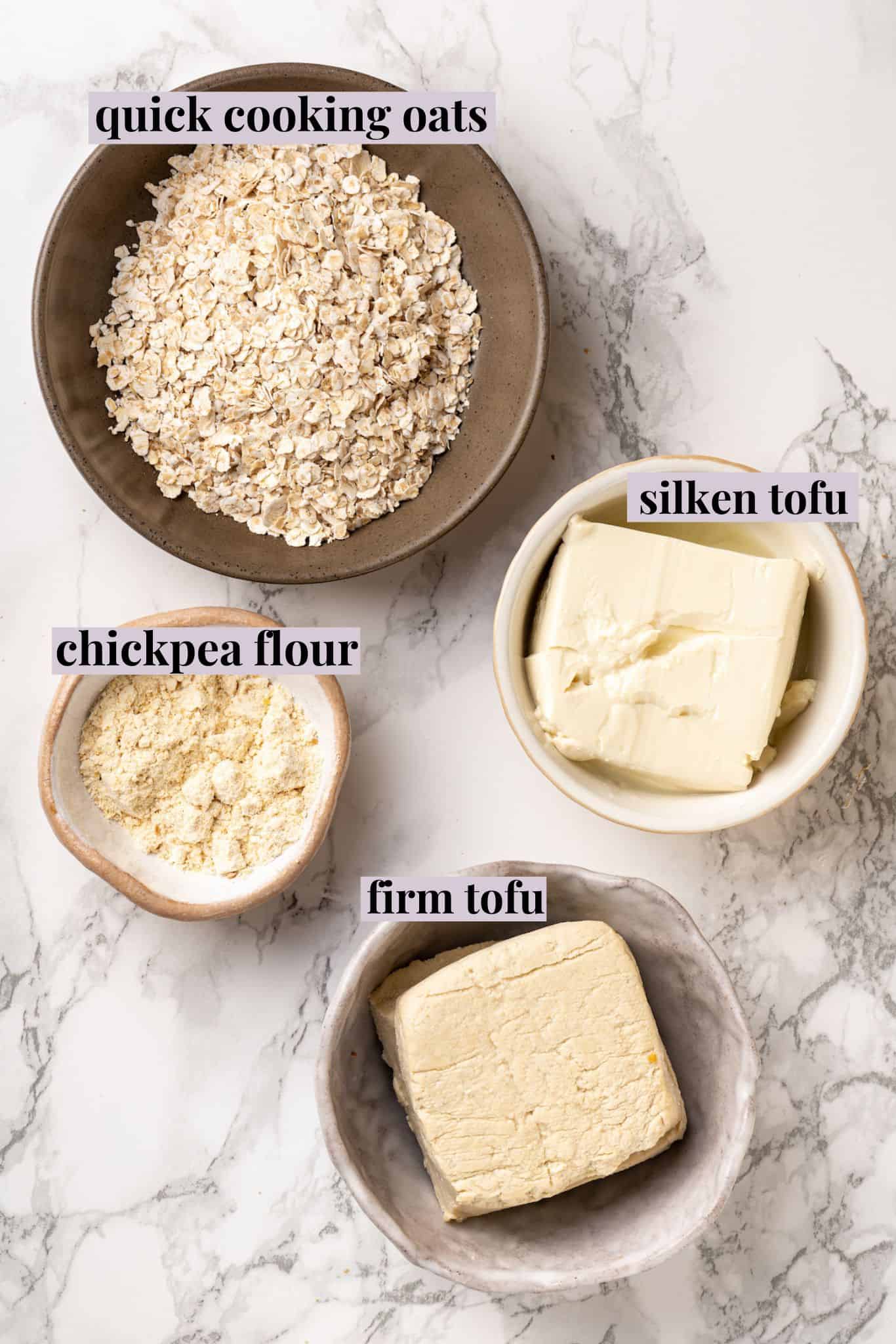 Overhead view of eggs, firm tofu, silken tofu, and chickpea flour