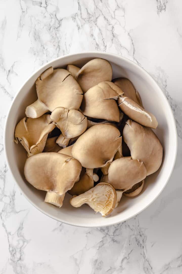 Overhead view of oyster mushrooms in bowl