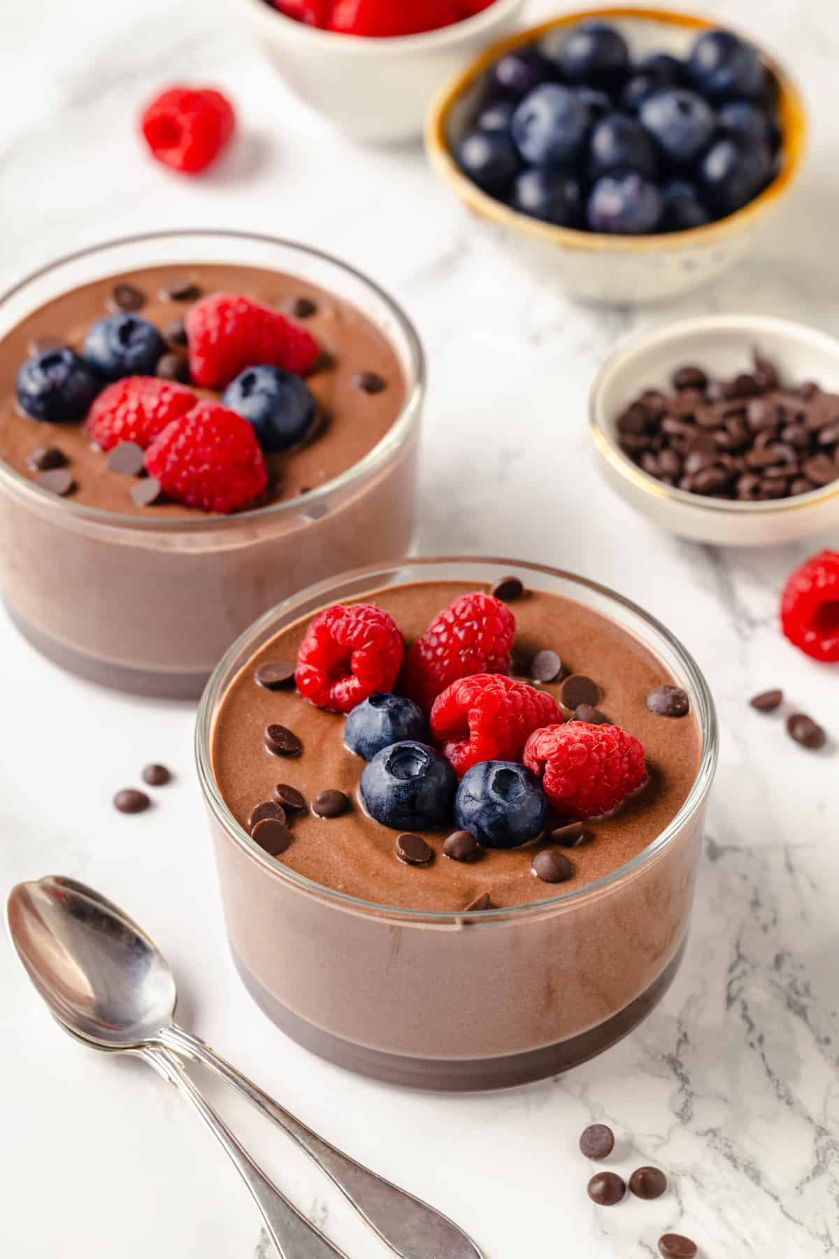 Two bowls of creamy chocolate protein pudding