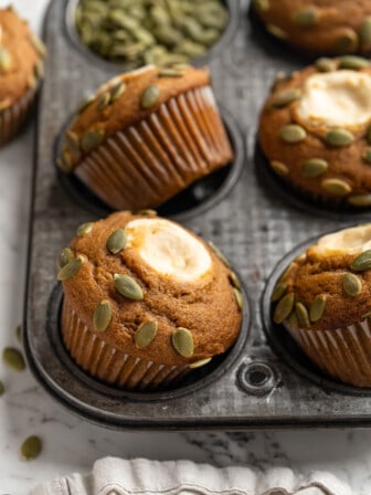 Pumpkin cream cheese muffins in pan