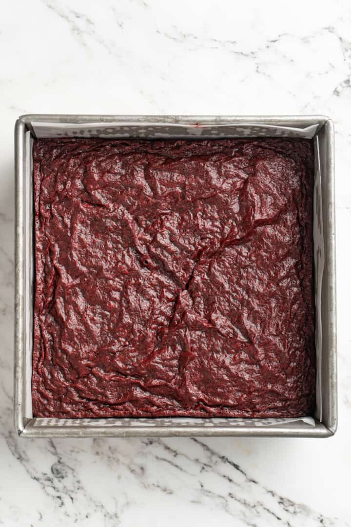 Overhead view of red velvet brownies cooling in pan