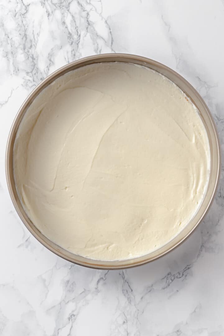 Overhead view of cheesecake in pan before baking