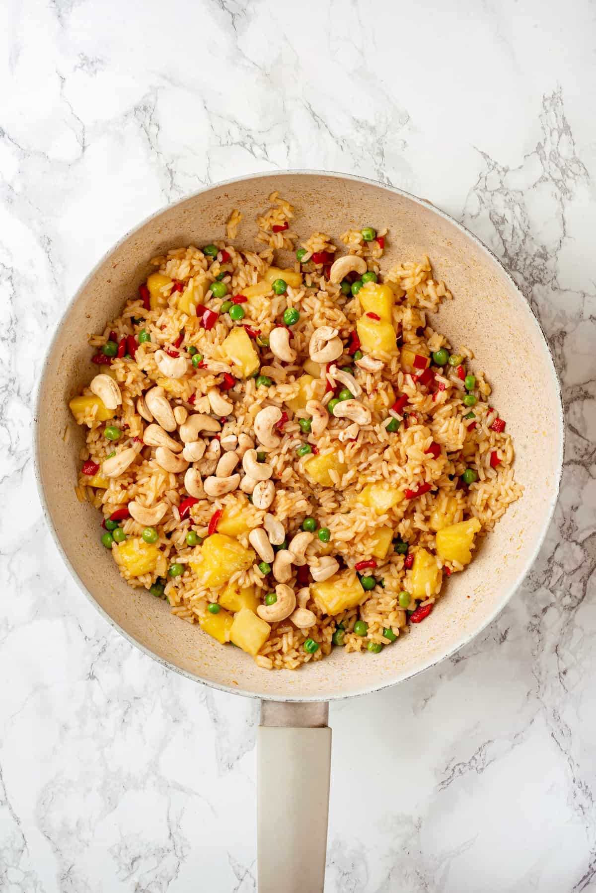 Overhead view of pineapple fried rice in pan