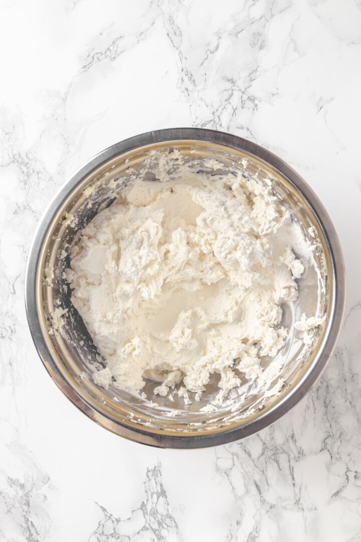 Overhead view of whipped vegan cream cheese in bowl