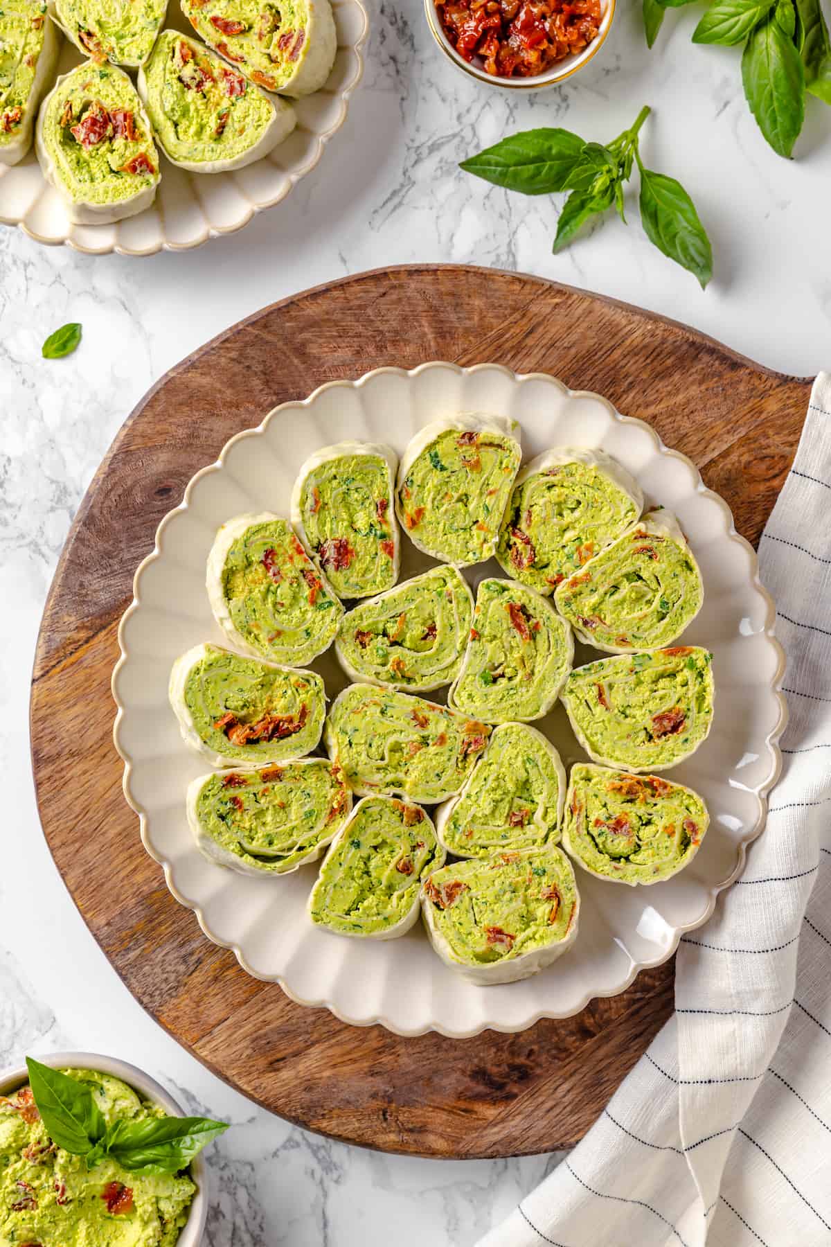 Overhead view of vegan tortilla roll-ups with pesto and cream cheese
