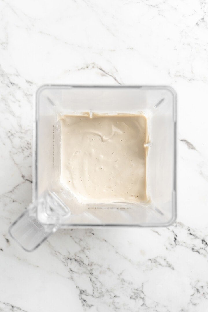Overhead view of vegan sour cream in blender