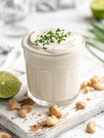Jar of vegan sour cream with chives on top