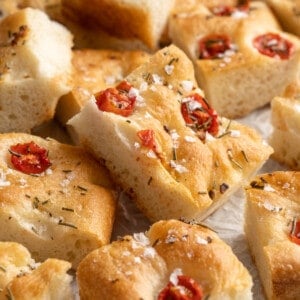 Pile of gluten-free focaccia on parchment paper