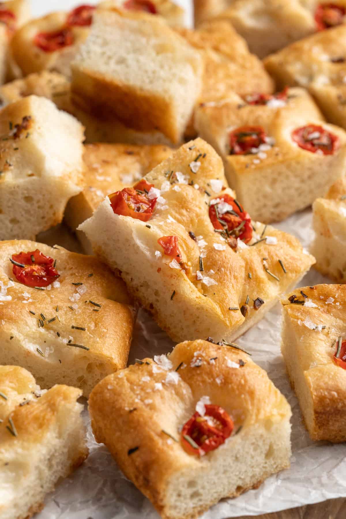 Pile of gluten-free focaccia on parchment paper