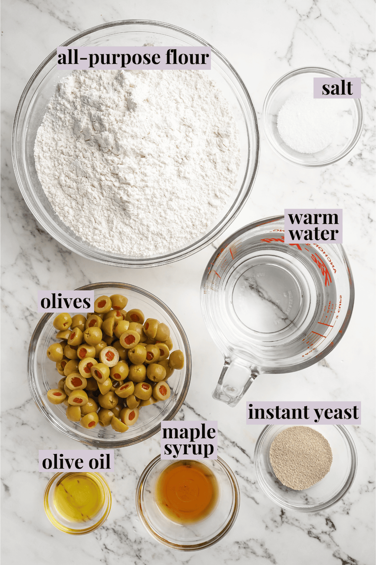 Overhead view of ingredients for olive bread with labels