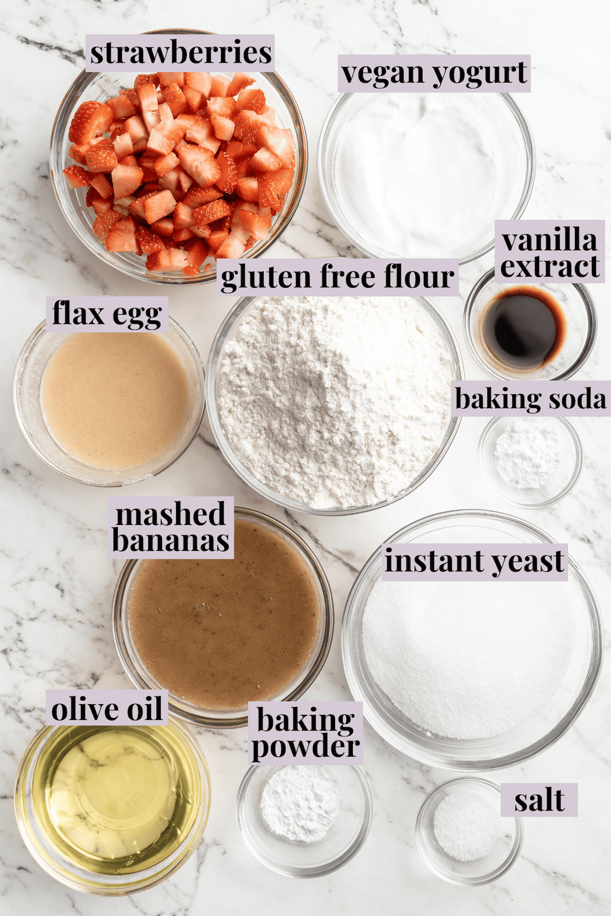 This strawberry banana bread is moist, flavourful, and so easy to make! It's vegan and gluten-free, so everyone can enjoy it. Overhead view of ingredients for strawberry banana bread with labels