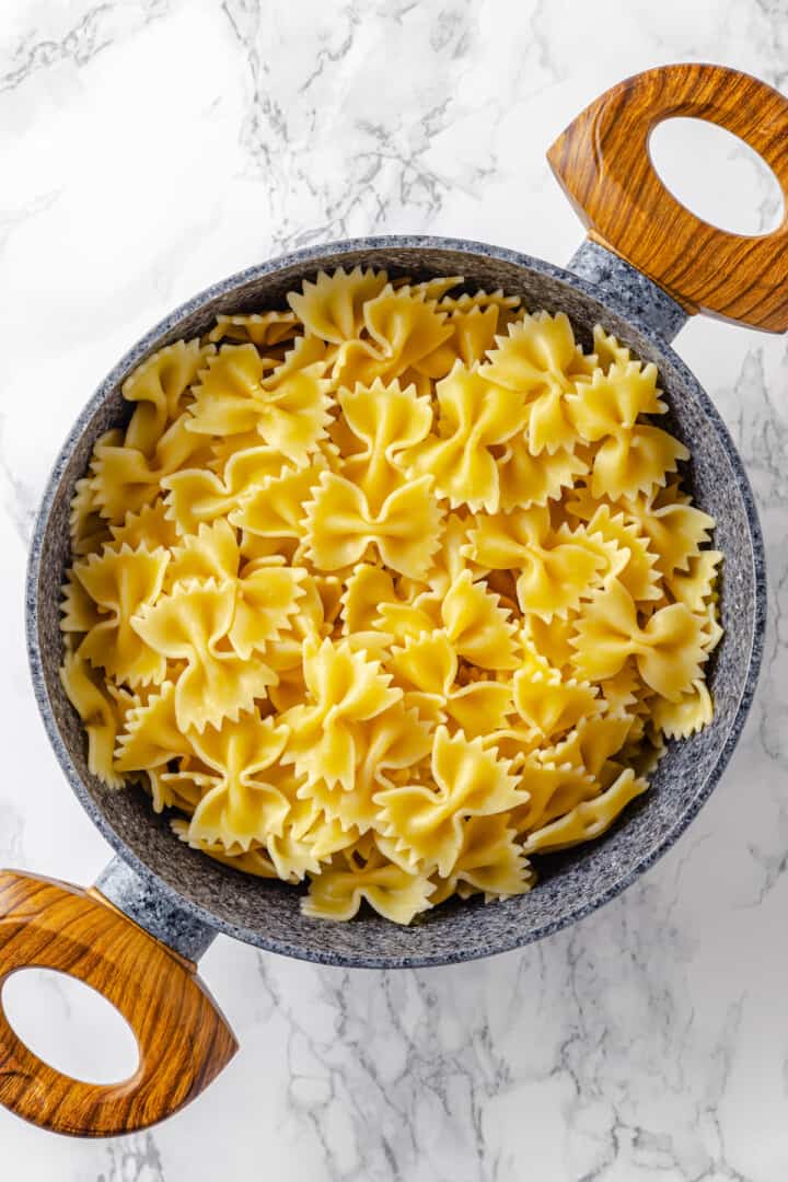 Cooked farfalle pasta in colander