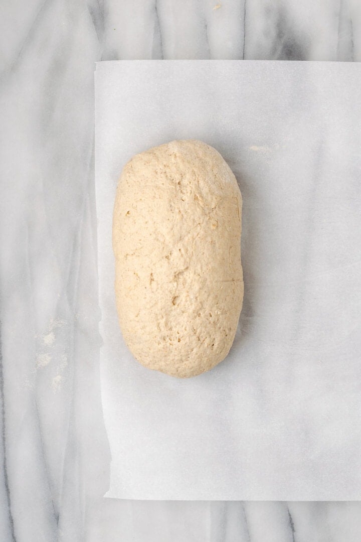 Overhead view of gluten-free bread dough on parchment paper