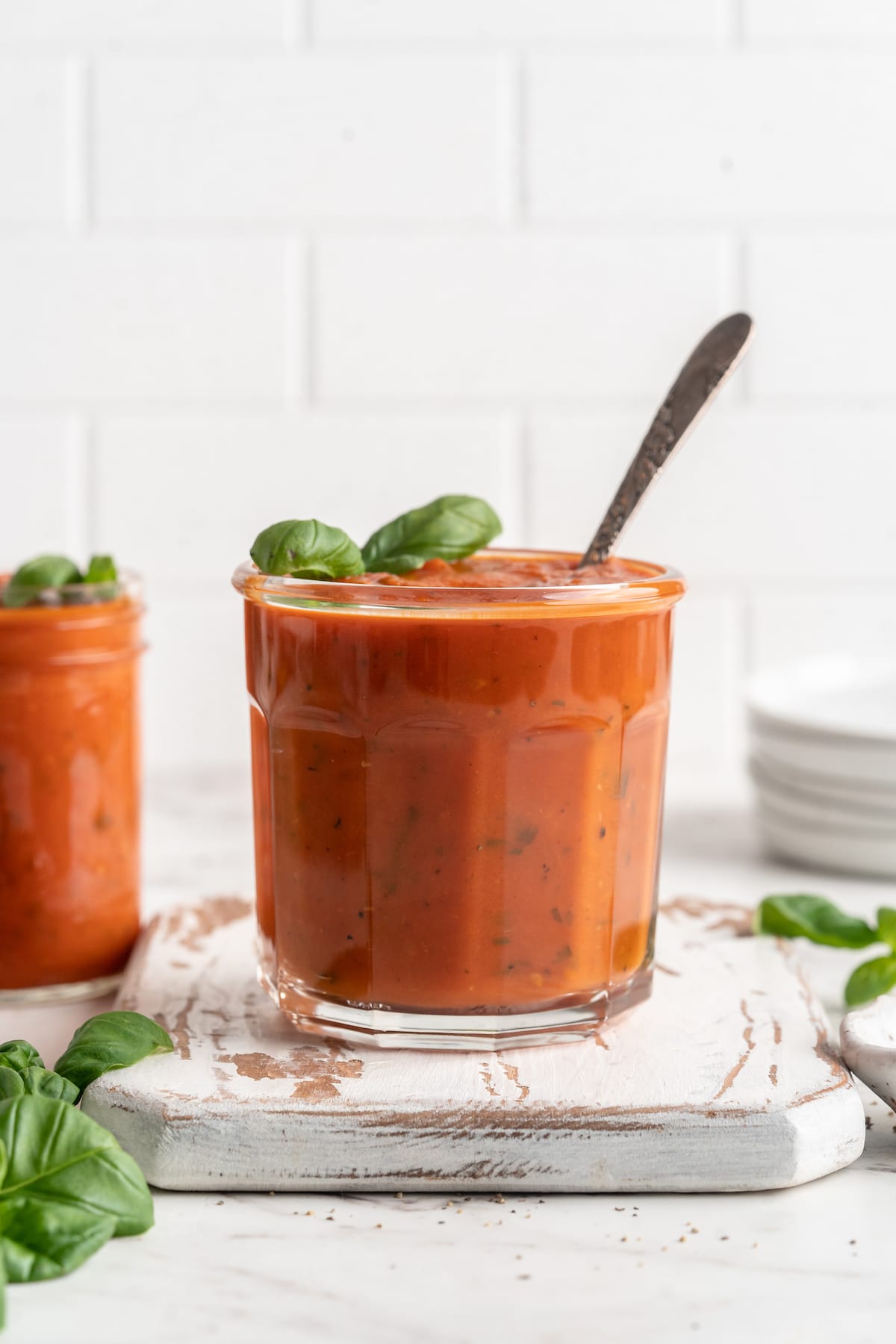 Jar of tomato sauce with spoon