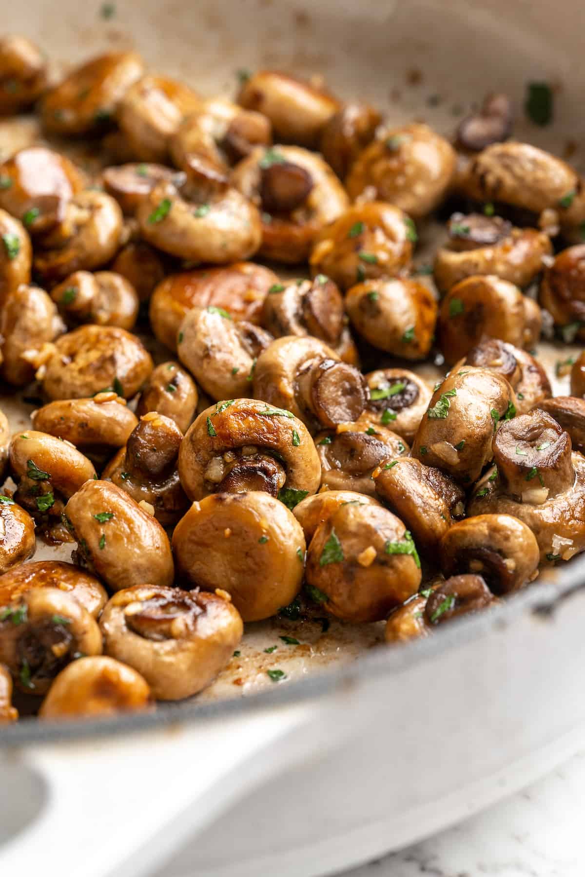 Garlic mushrooms in skillet
