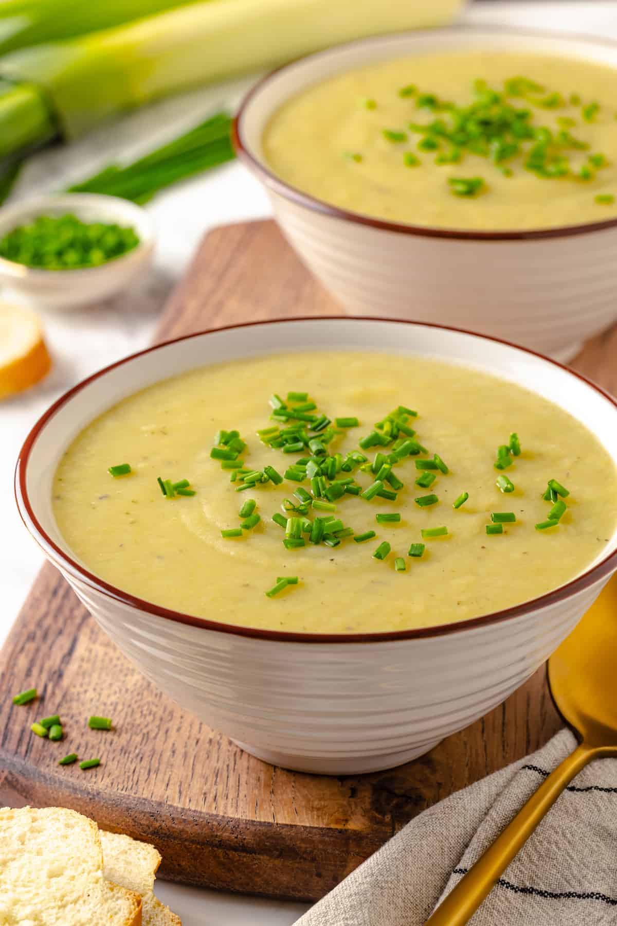 Two bowls of vegan vichyssoise with chives