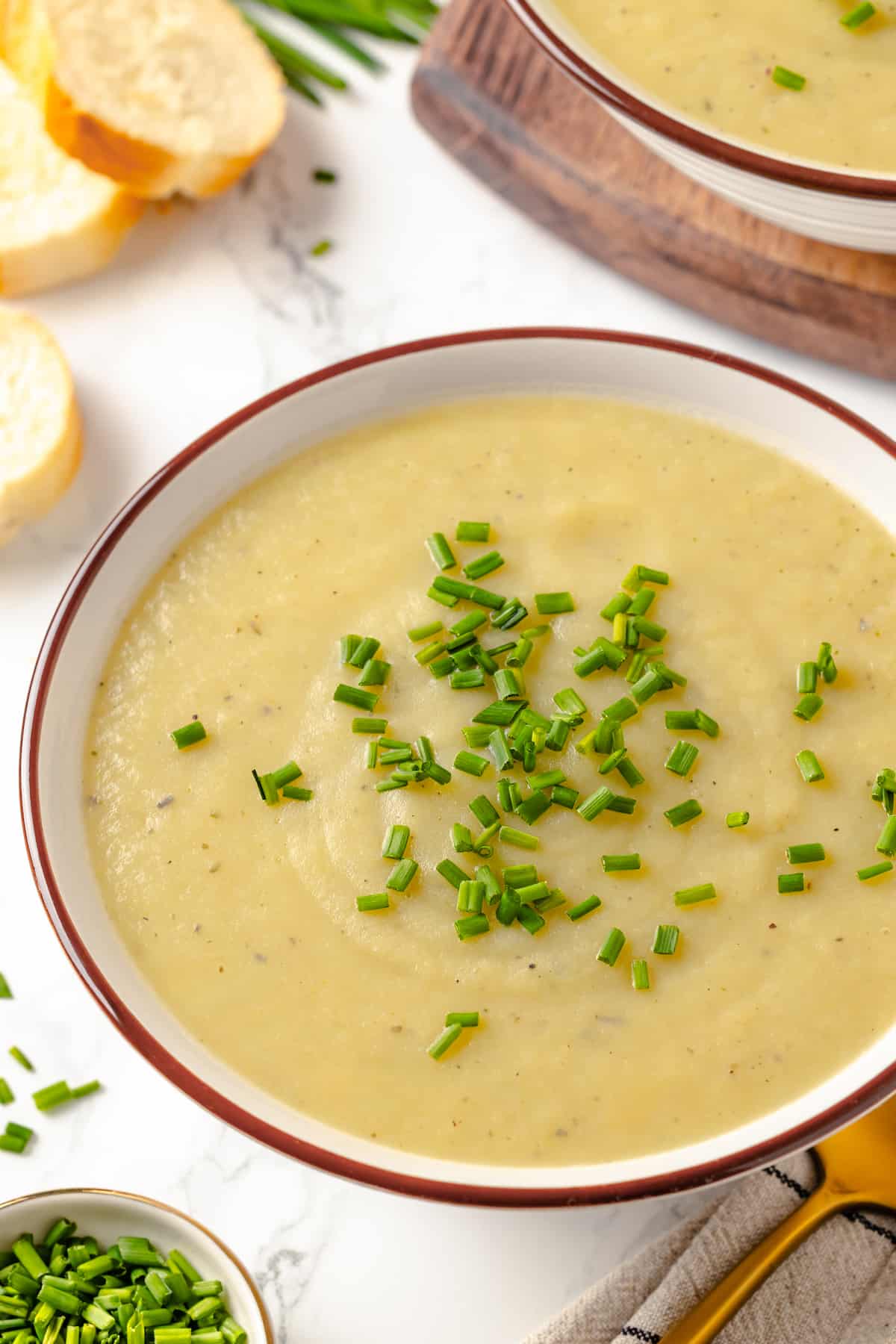 Bowl of creamy vichyssoise with chives for garnish