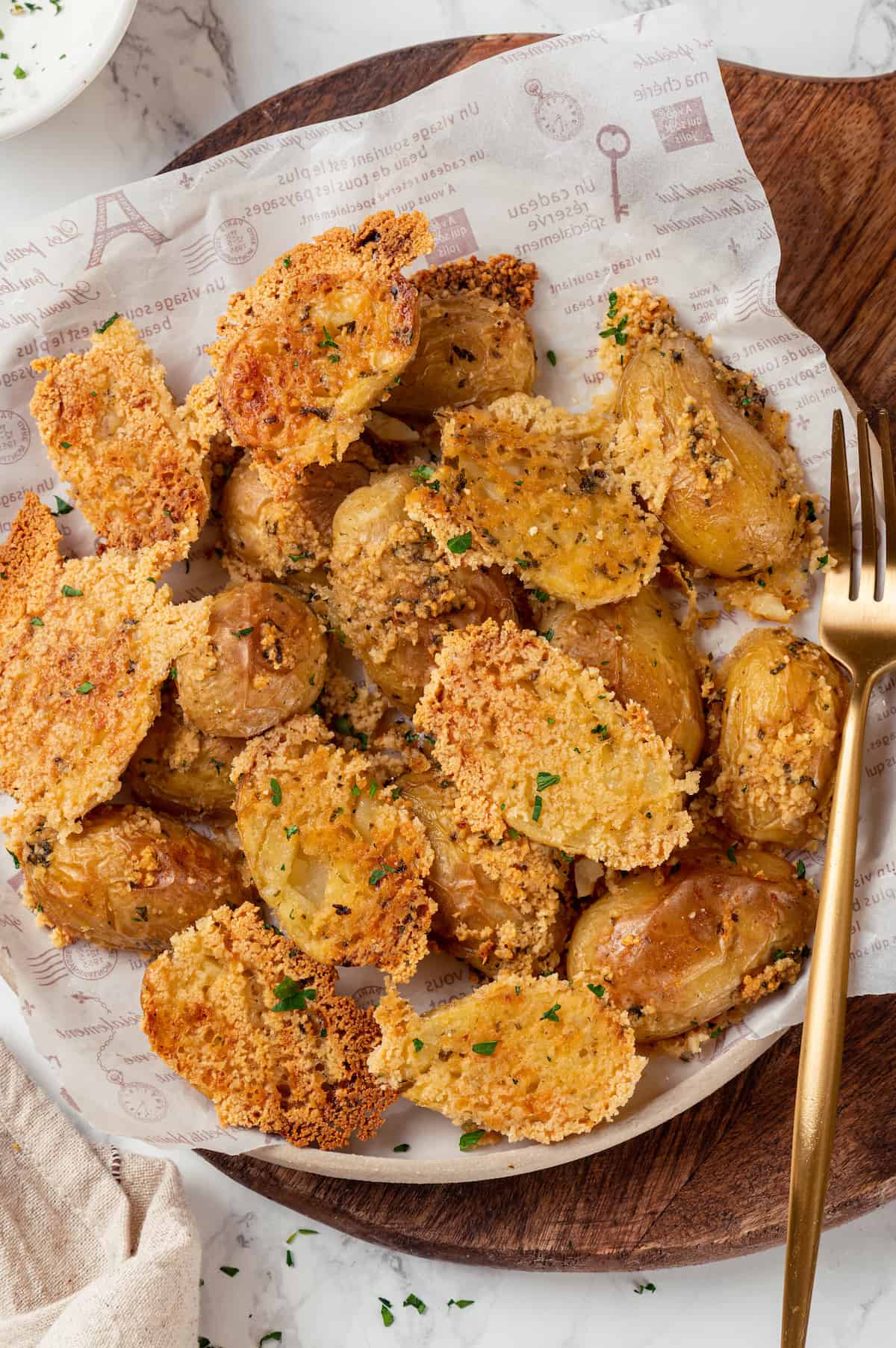 Vegan Parmesan-crusted potatoes on plate