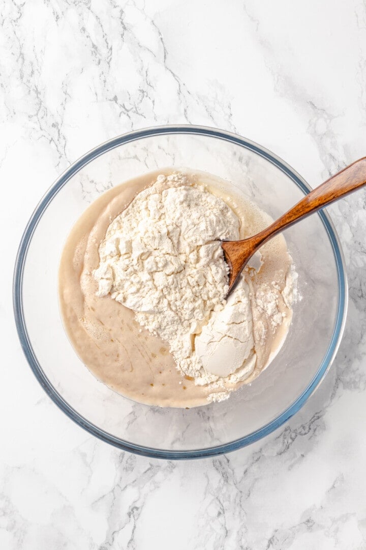 Stirring flour into dough for pretzel bites