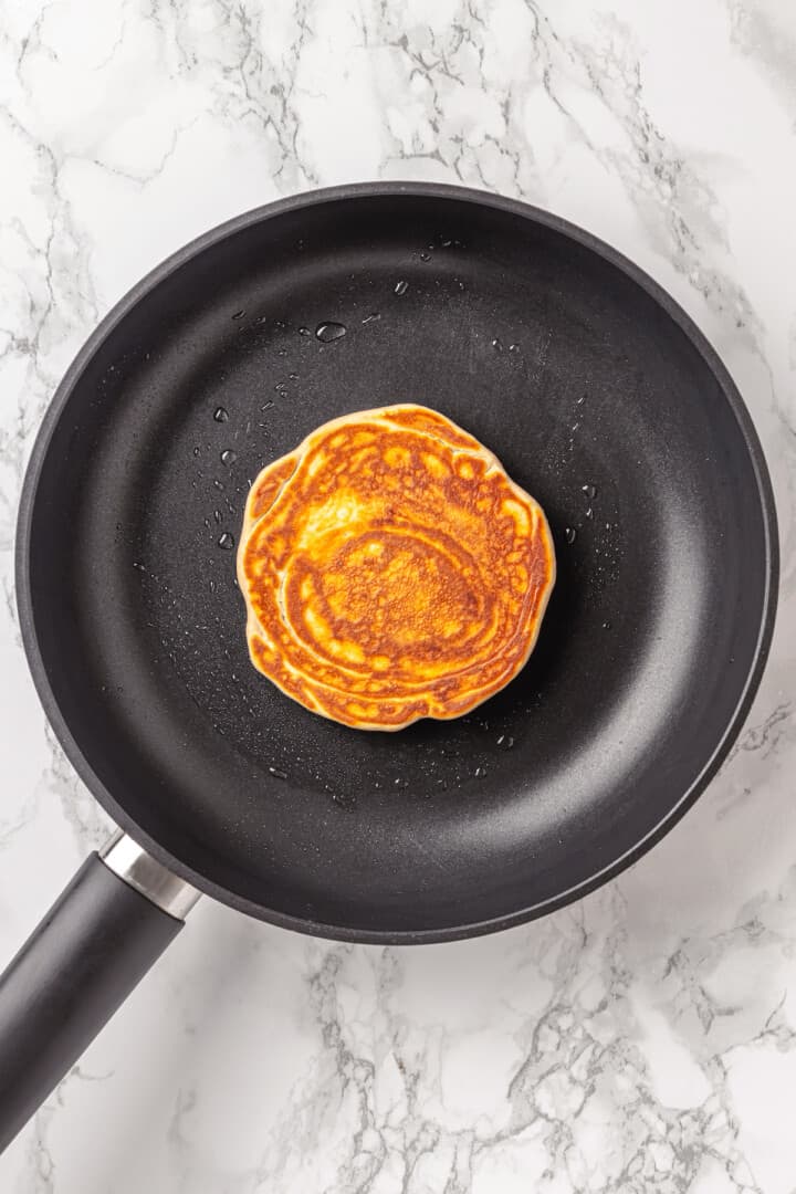 Overhead view of pancake in skillet