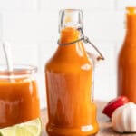 Bottles and jar of Scotch bonnet pepper hot sauce