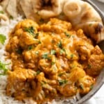 Bowl of butter cauliflower over rice with naan