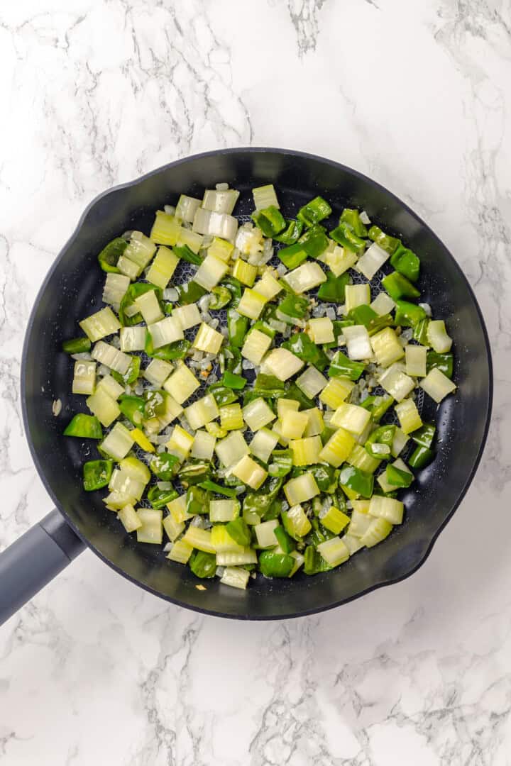 Celery, onion, and green pepper in skillet