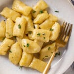 Overhead view of vegan gnocchi in bowl with fork - 10