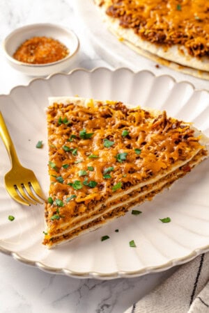 Slice of layered vegan taco bake on plate