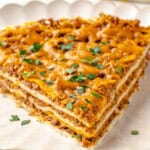 Slice of layered taco bake on plate
