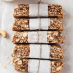 Overhead view of 5 homemade granola bars on parchment paper